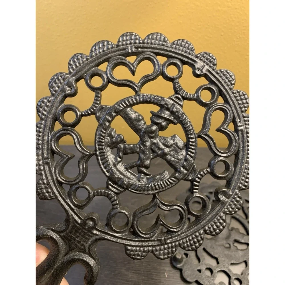 Two Fancy Vintage Cast Iron Trivets Black J.Z.H Amish Boy Girl 1952